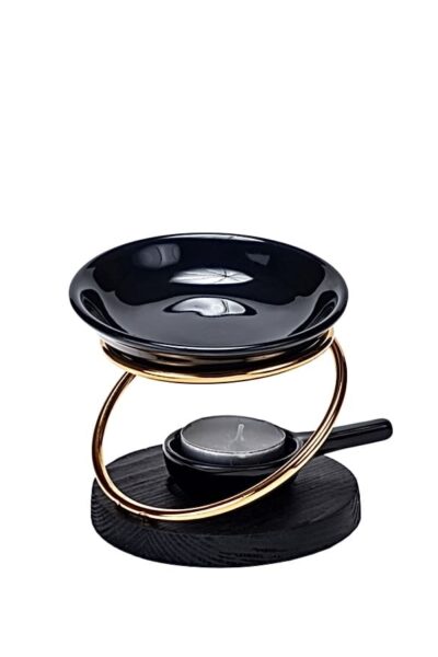Black porcelain wax melter with gold metal base and tealight candle holder
